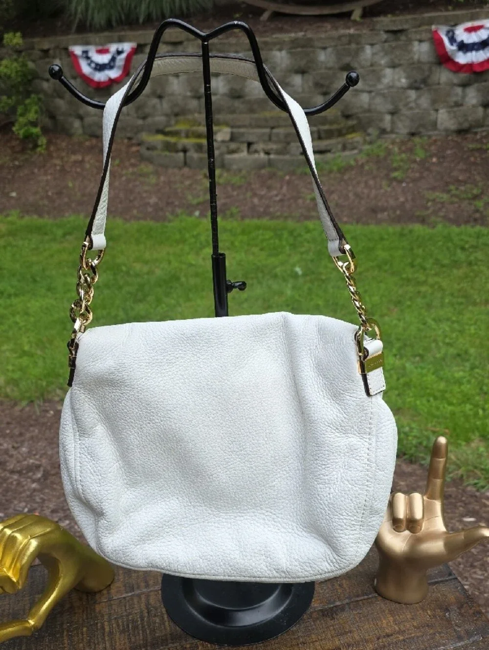 Michael Kors Bedford shoulder bag features a fold-over zipper flap